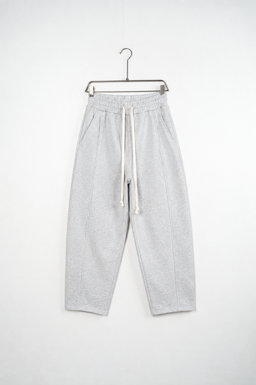 Pantaloni Baggy Felpați Bărbați Gri Melanj, vedere frontală pe umeraș, fundal deschis