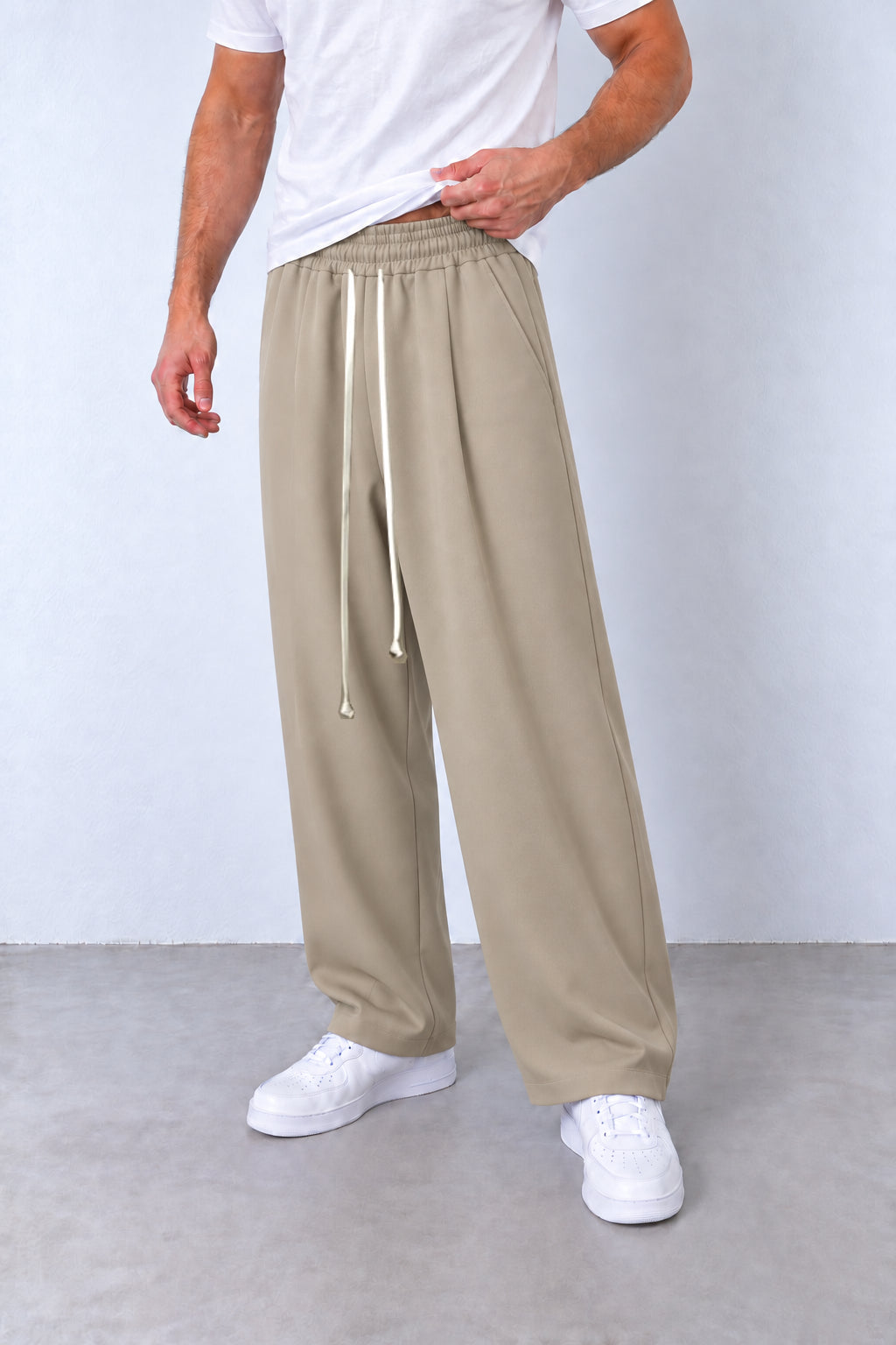 Pantaloni baggy bej din trei sferturi, buzunar și cusătură laterală