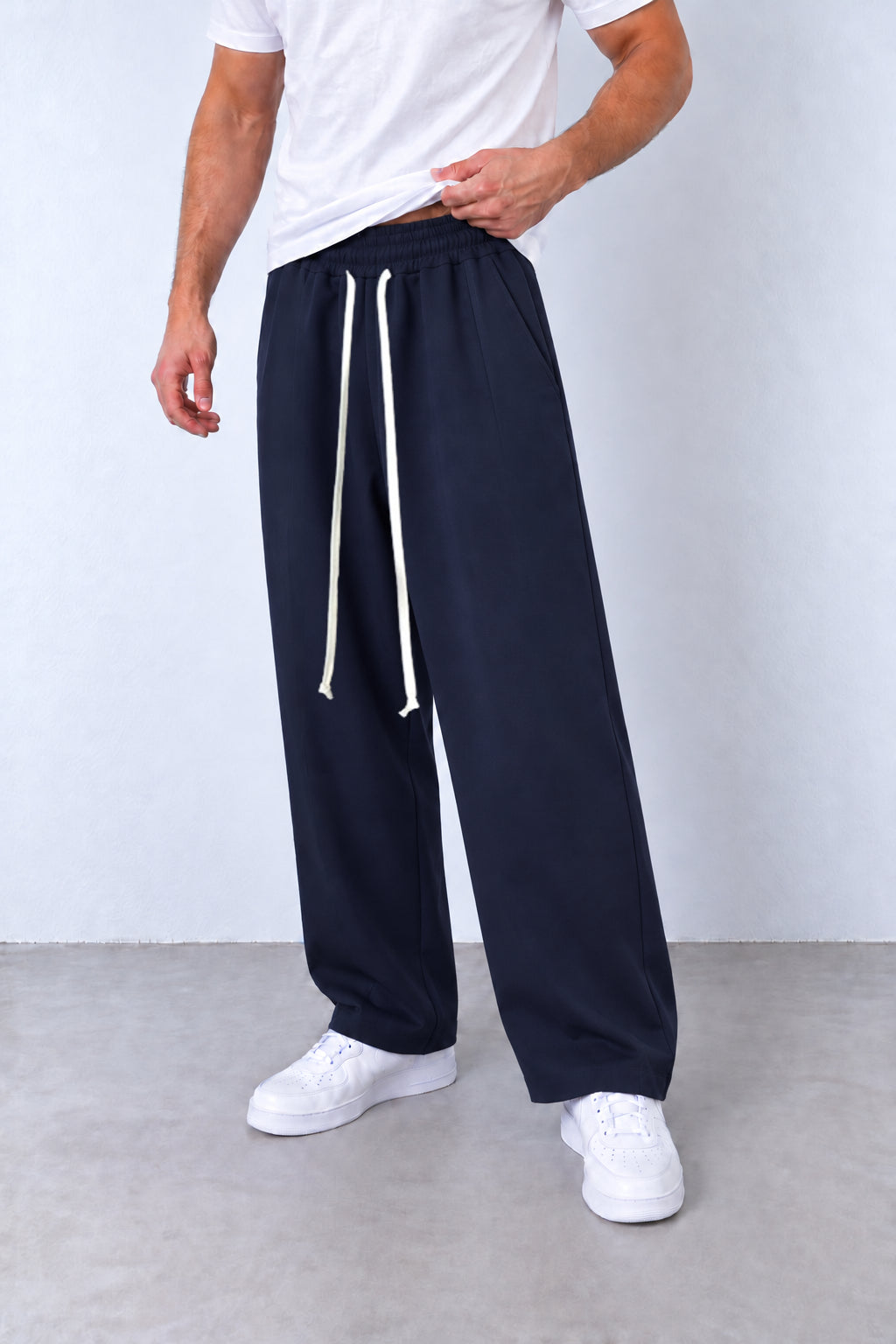 Pantaloni baggy bleumarin din trei sferturi, buzunar și cusătură laterală