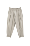 Pantaloni crem slim cu șiret lung și talie elastică, perfecți pentru outfituri casual moderne și confortabile.