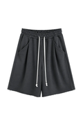 Pantaloni gri închis oversized cu șnur lung în talie, având o cusătură decorativă frontală pe centrul piciorului, confecționa