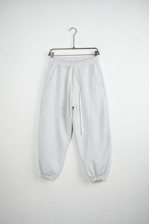 Pantaloni Jogger Balloon Fit Bărbați Gri Melanj, vedere frontală pe umeraș, fundal deschis