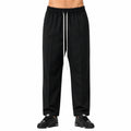 Pantaloni cu croială largă bărbați negri, purtați de model, vedere frontală