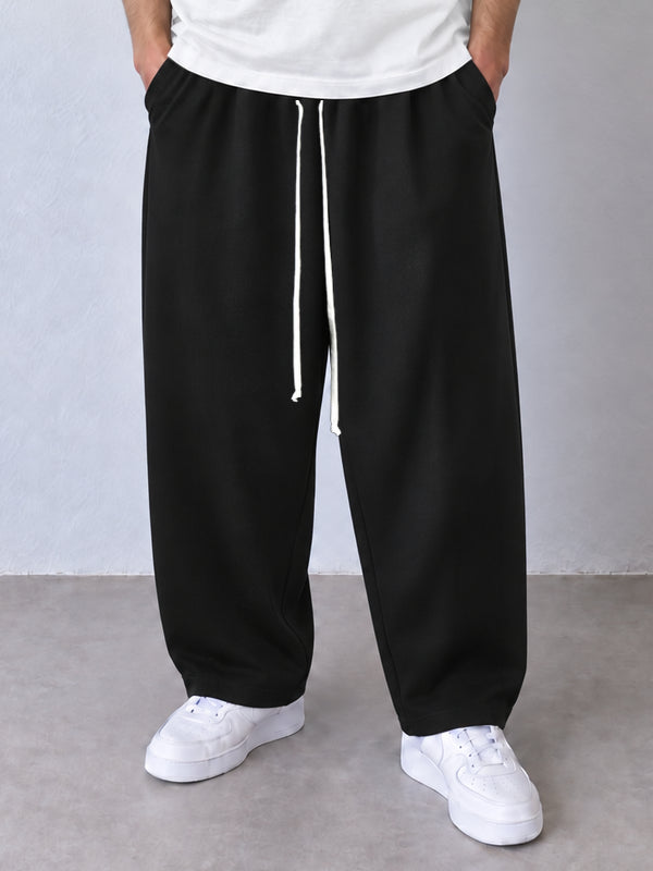 Detaliu pantaloni negri 202501-INV, talie cu șnur textil lung și croială baggy