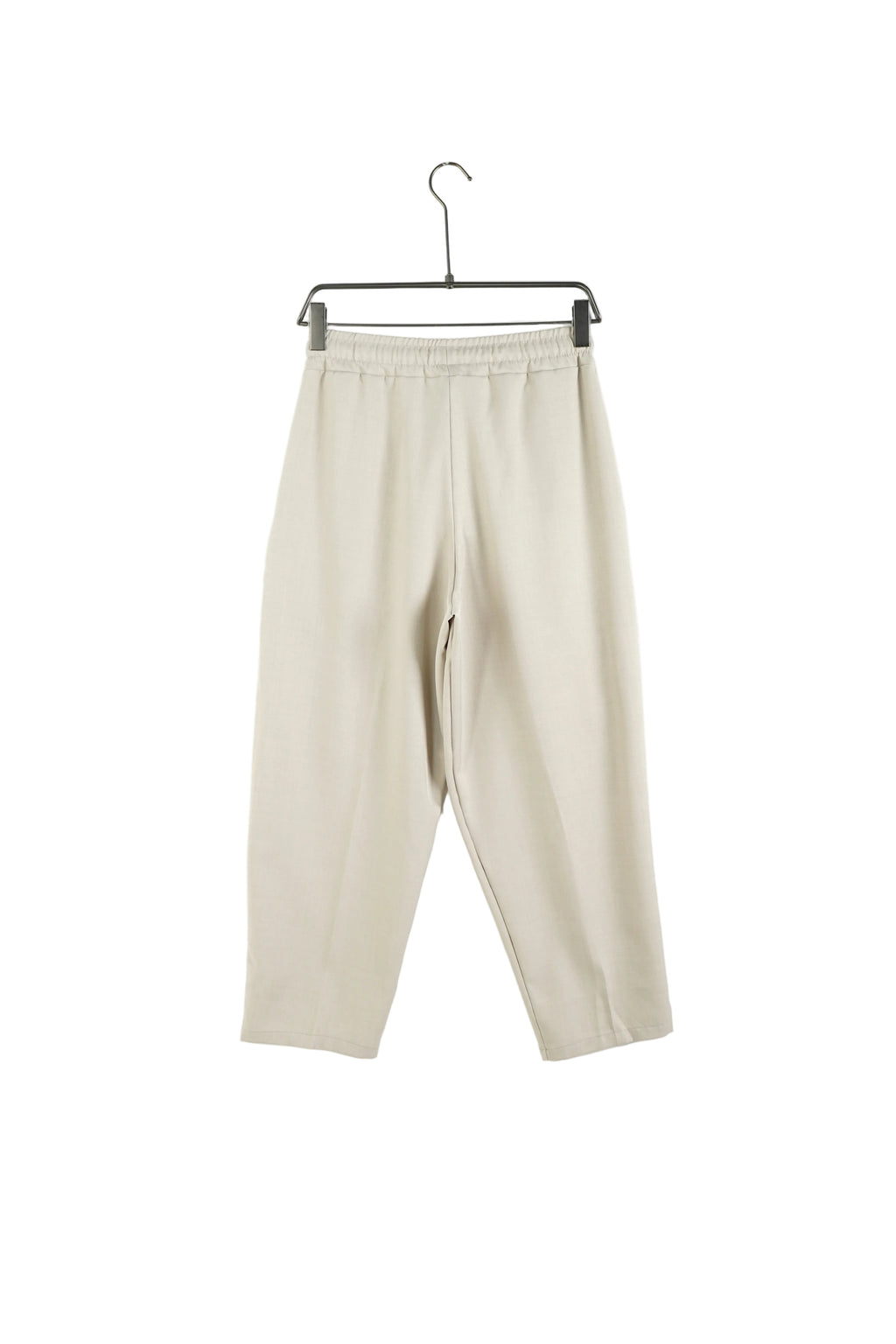 Vedere frontală pantaloni oversize bej cu talie elastică și șiret lung reglabil