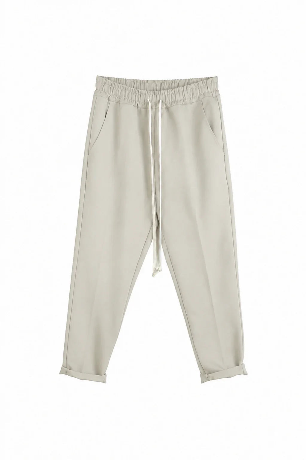 Detaliu talie elastică și șnur la pantalonii slim crem pentru bărbați