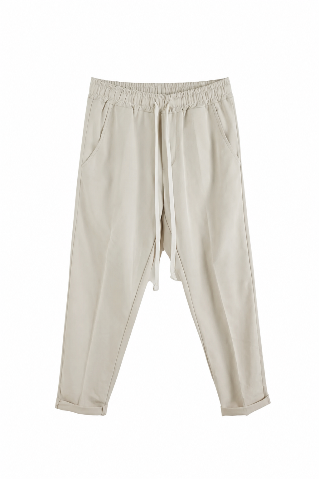 Pantaloni crem slim cu șiret lung și talie elastică, ideali pentru outfituri casual moderne și confortabile.