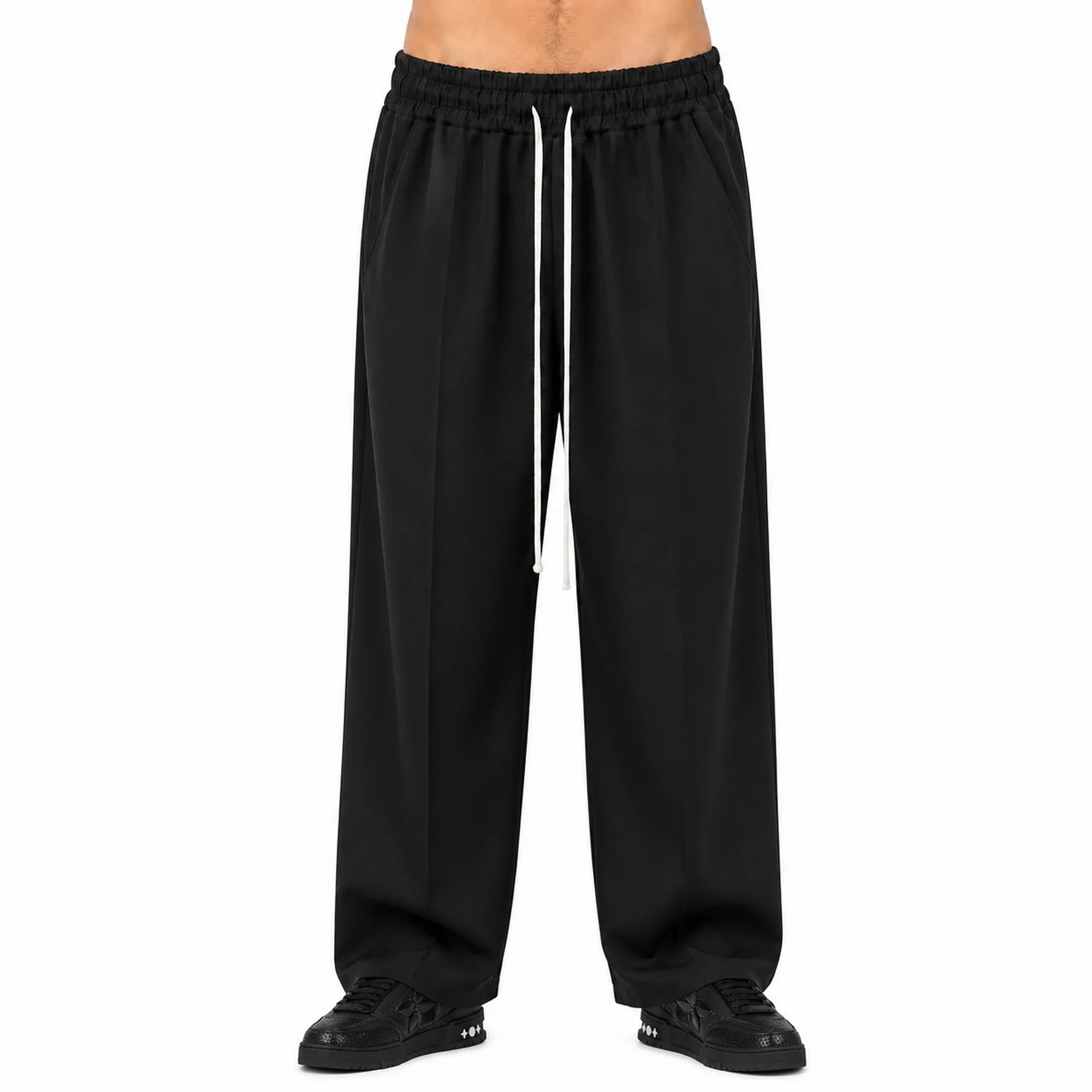 Pantaloni wide leg bărbați negri, purtați de model, vedere frontală